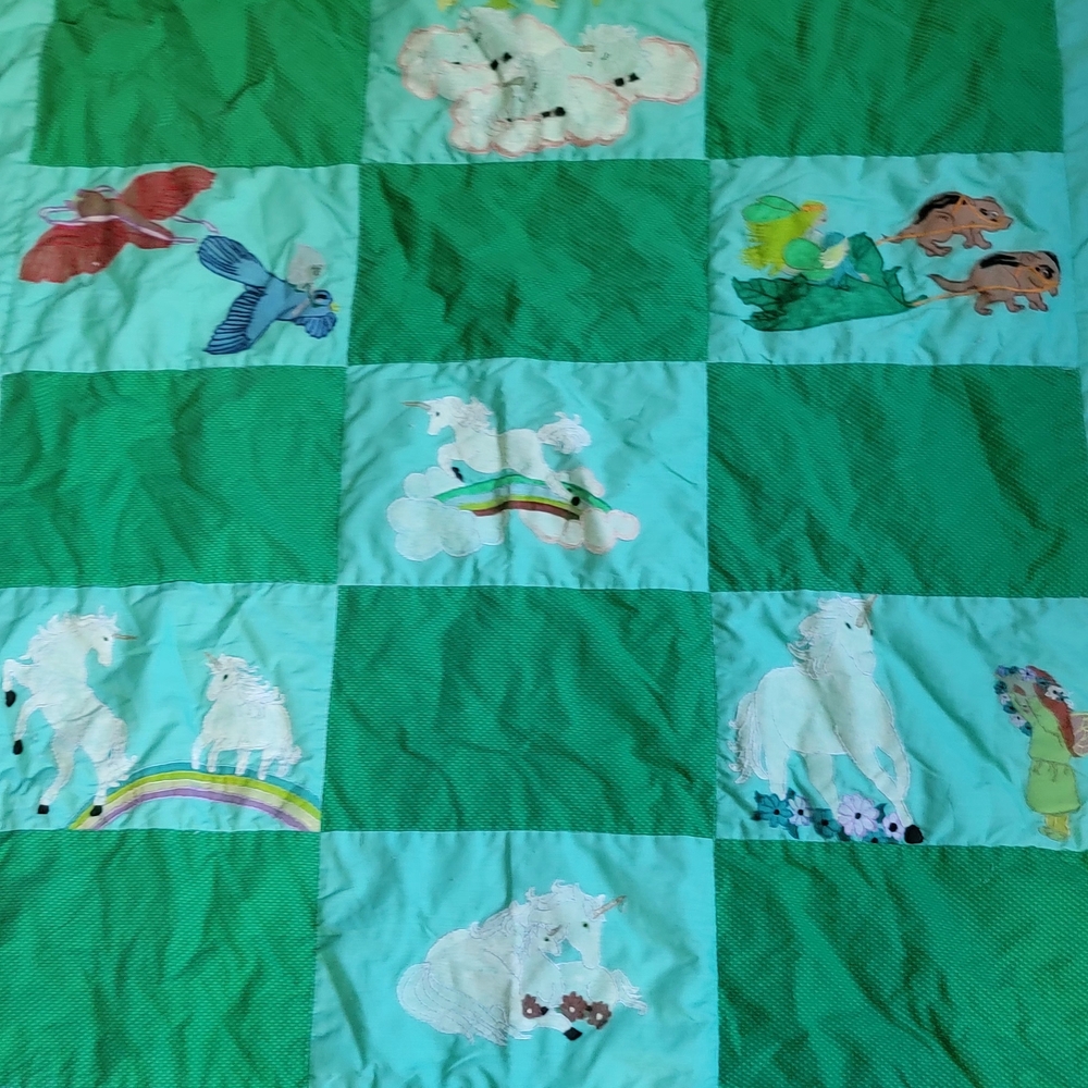 Green Patchwork Quilt with Animal Designs